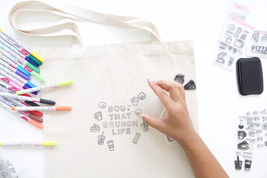 Use a few supplies to create a customized easy stamped canvas tote bag that you can color with fabric markers