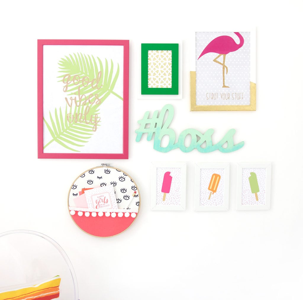 Gallery Walls can be intimidating, which is why I've avoided them until recently. Create your very own colorful Cricut Explore Gallery Wall with just a few cheap frames and some simple craft supplies.