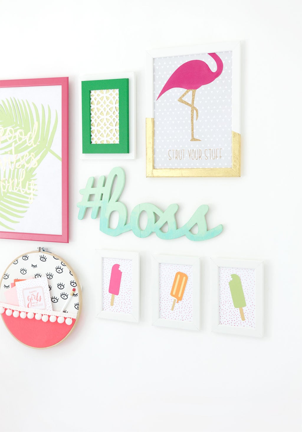 Gallery Walls can be intimidating, which is why I've avoided them until recently. Create your very own colorful Cricut Explore Gallery Wall with just a few cheap frames and some simple craft supplies.