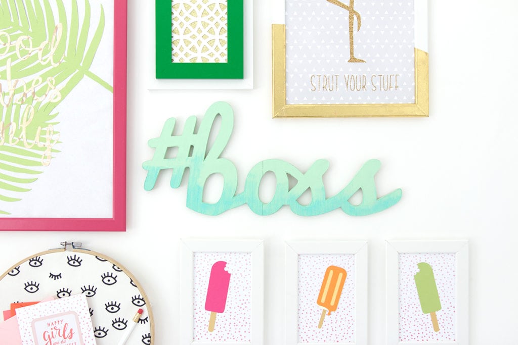 Gallery Walls can be intimidating, which is why I've avoided them until recently. Create your very own colorful Cricut Explore Gallery Wall with just a few cheap frames and some simple craft supplies.