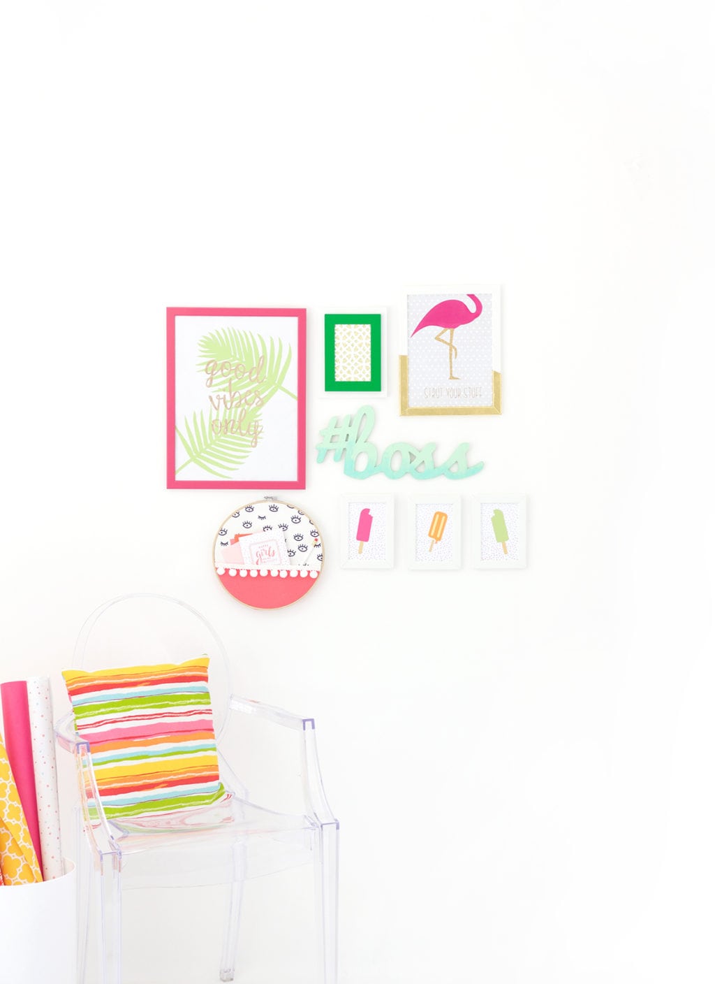 Gallery Walls can be intimidating, which is why I've avoided them until recently. Create your very own colorful Cricut Explore Gallery Wall with just a few cheap frames and some simple craft supplies.