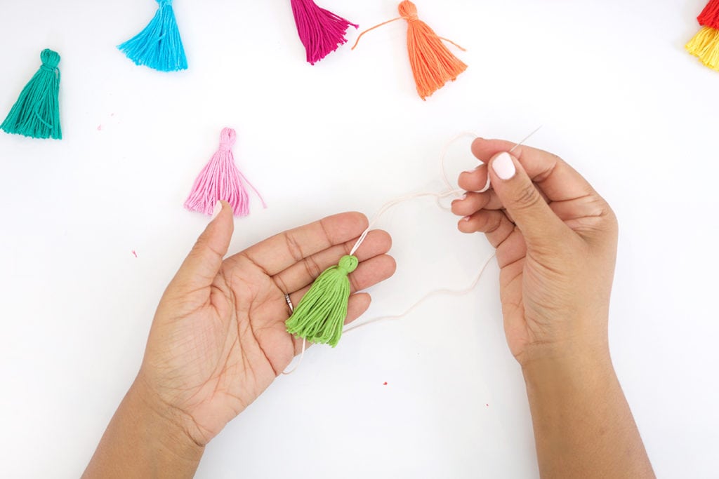 Use embroidery floss to create bold DIY tiered tassels for your beach tote.