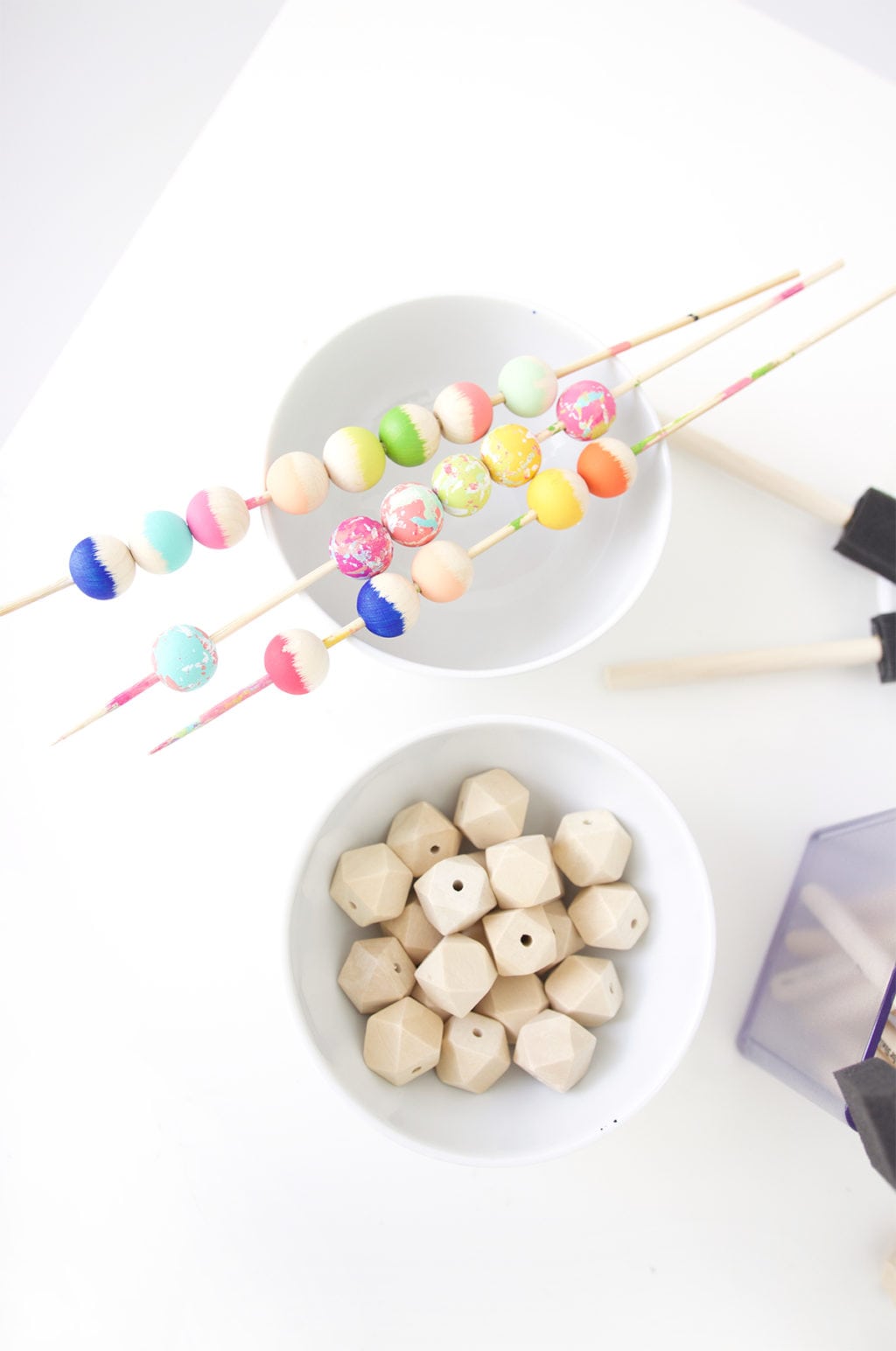 Grab some paint and learn how to paint wooden beads in a variety of different patterns..