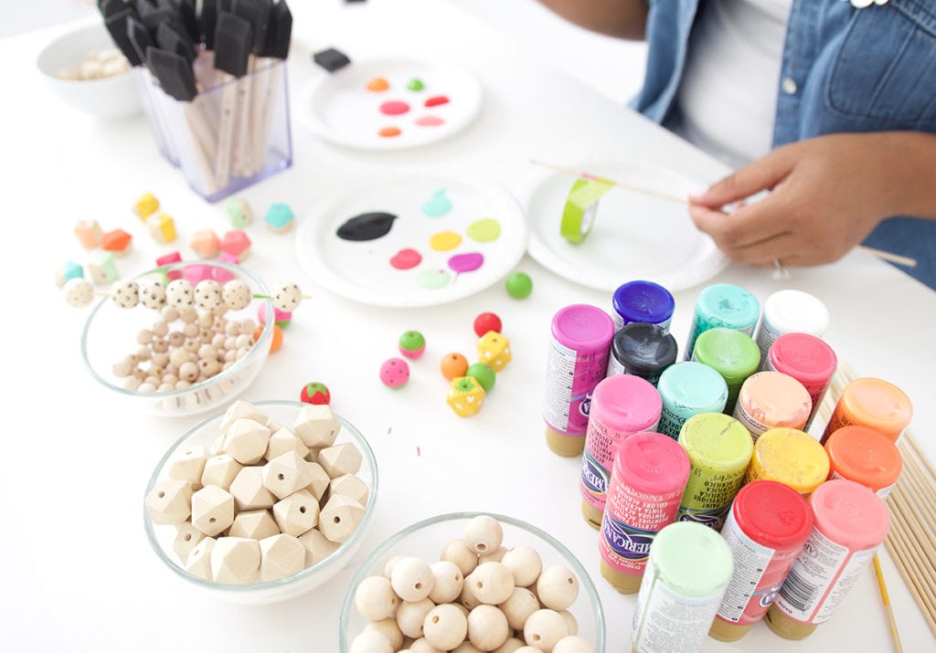 Grab some paint and learn how to paint wooden beads in a variety of different patterns..