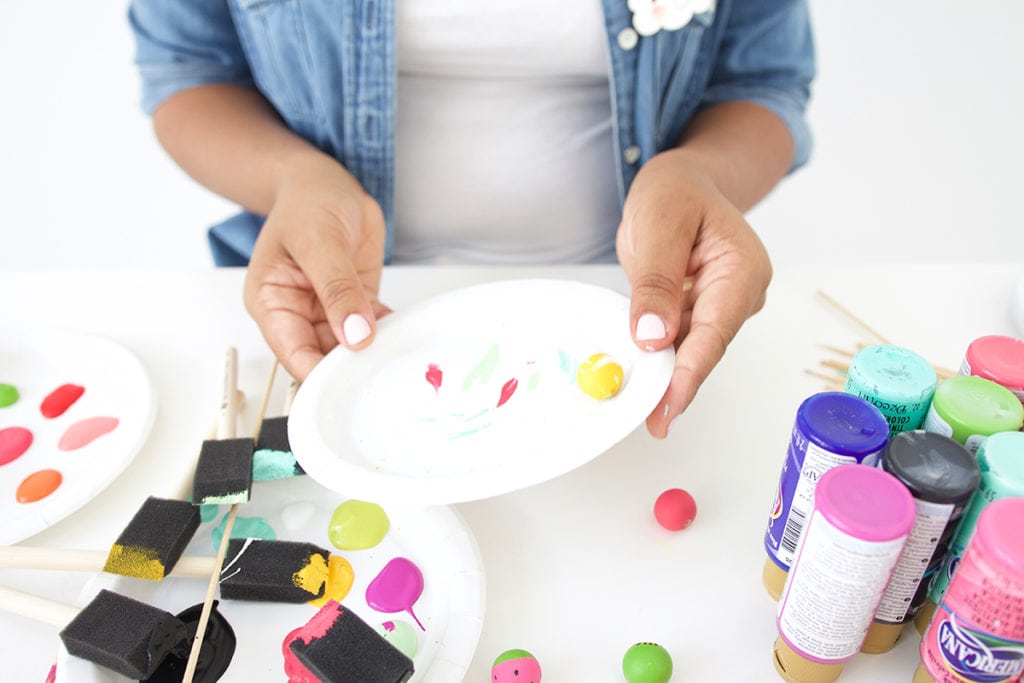 Grab some paint and learn how to paint wooden beads in a variety of different patterns..