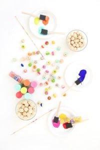 Grab some paint and learn how to paint wooden beads in a variety of different patterns..