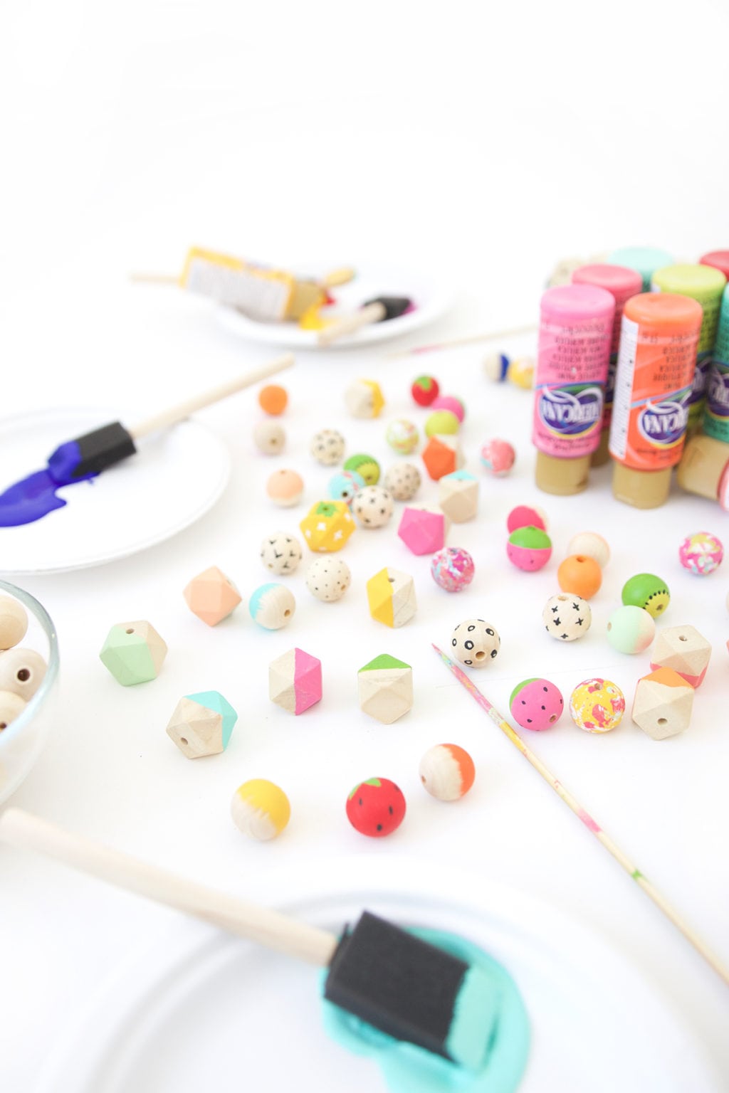 Grab some paint and learn how to paint wooden beads in a variety of different patterns..