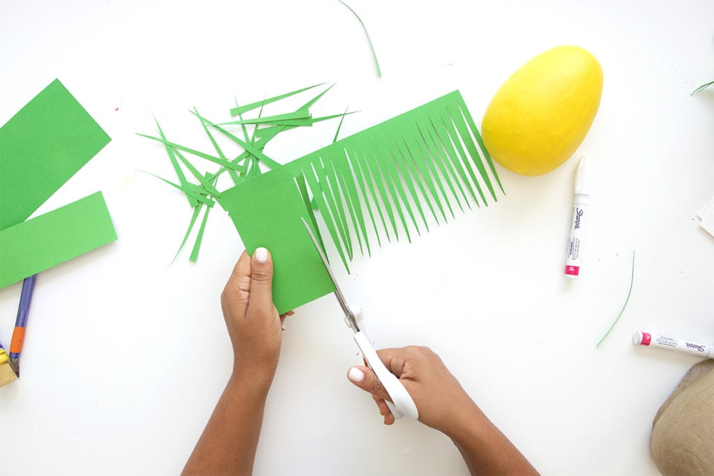 Mimic the look of taxidermy with a paper mache egg and some paint. This 3D diy paper mache pineapple wall art is a show stopper and a perfect addition to your gallery wall.