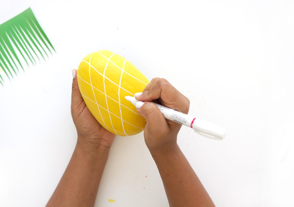 Mimic the look of taxidermy with a paper mache egg and some paint. This 3D diy paper mache pineapple wall art is a show stopper and a perfect addition to your gallery wall.