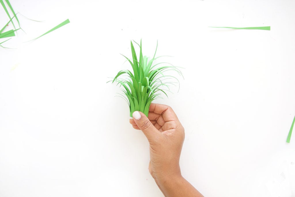 Mimic the look of taxidermy with a paper mache egg and some paint. This 3D diy paper mache pineapple wall art is a show stopper and a perfect addition to your gallery wall.