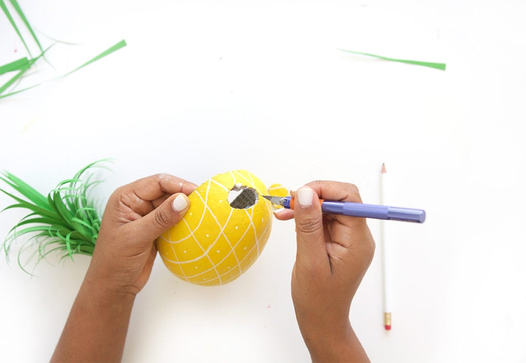 Mimic the look of taxidermy with a paper mache egg and some paint. This 3D diy paper mache pineapple wall art is a show stopper and a perfect addition to your gallery wall.