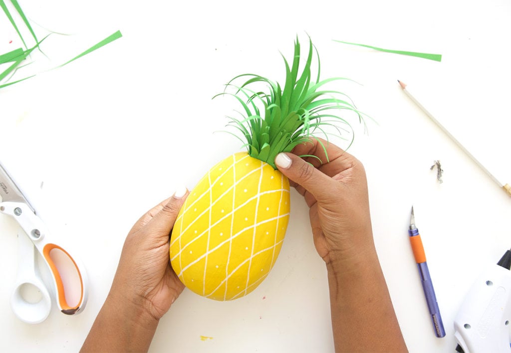 Mimic the look of taxidermy with a paper mache egg and some paint. This 3D diy paper mache pineapple wall art is a show stopper and a perfect addition to your gallery wall.