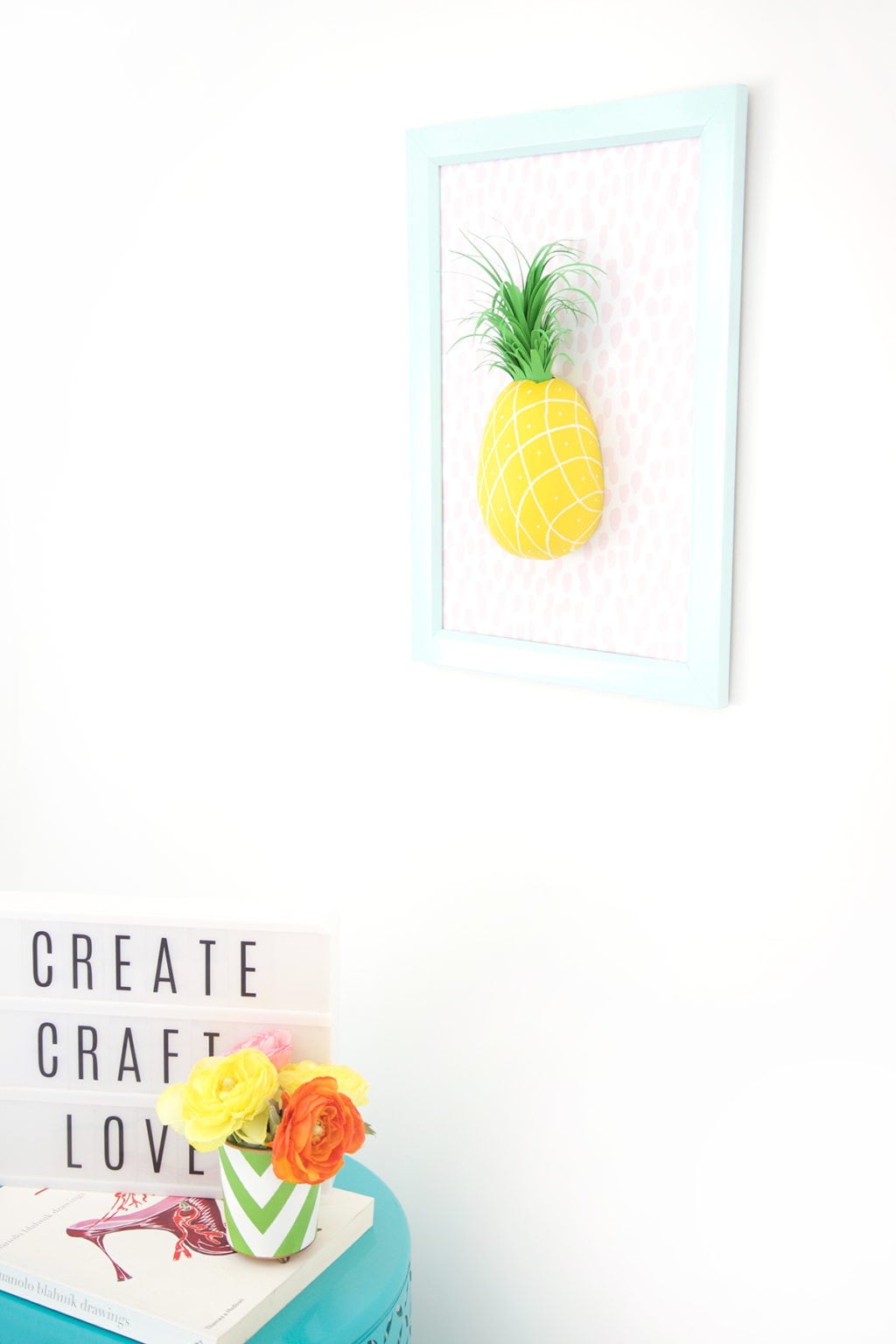 Mimic the look of taxidermy with a paper mache egg and some paint. This 3D diy paper mache pineapple wall art is a show stopper and a perfect addition to your gallery wall.