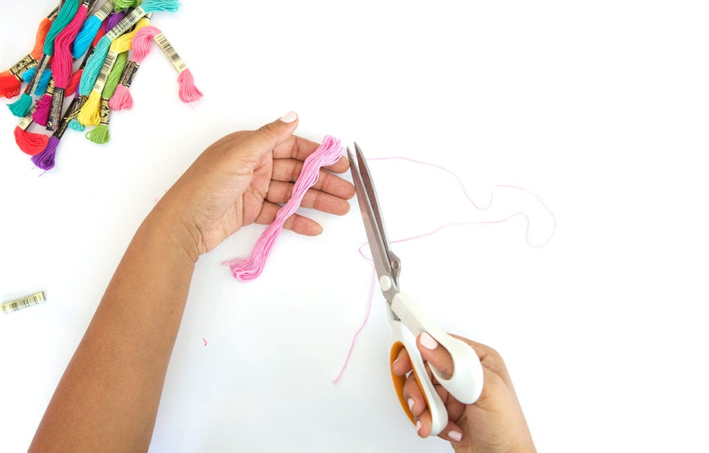 Use embroidery floss to create bold DIY tiered tassels for your beach tote.