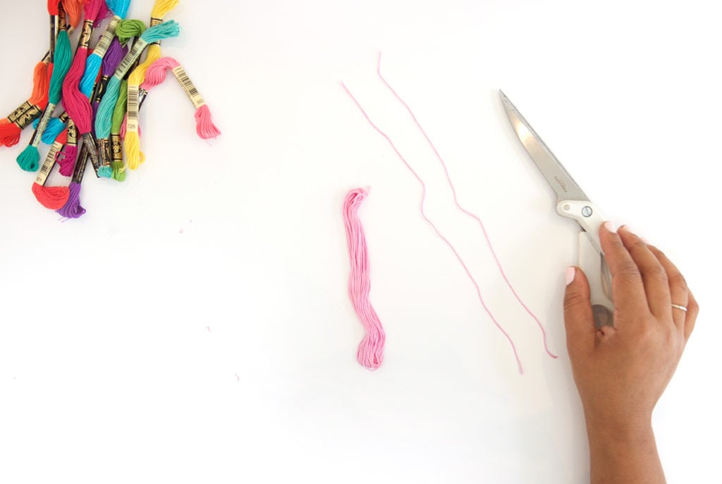 Use embroidery floss to create bold DIY tiered tassels for your beach tote.