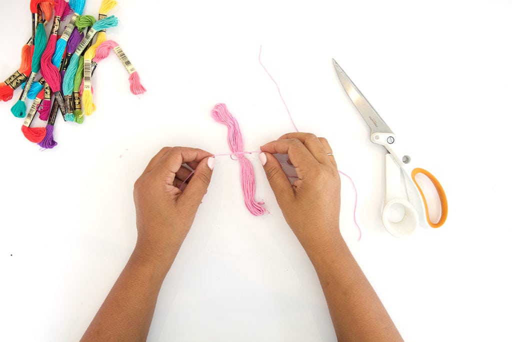 Use embroidery floss to create bold DIY tiered tassels for your beach tote.