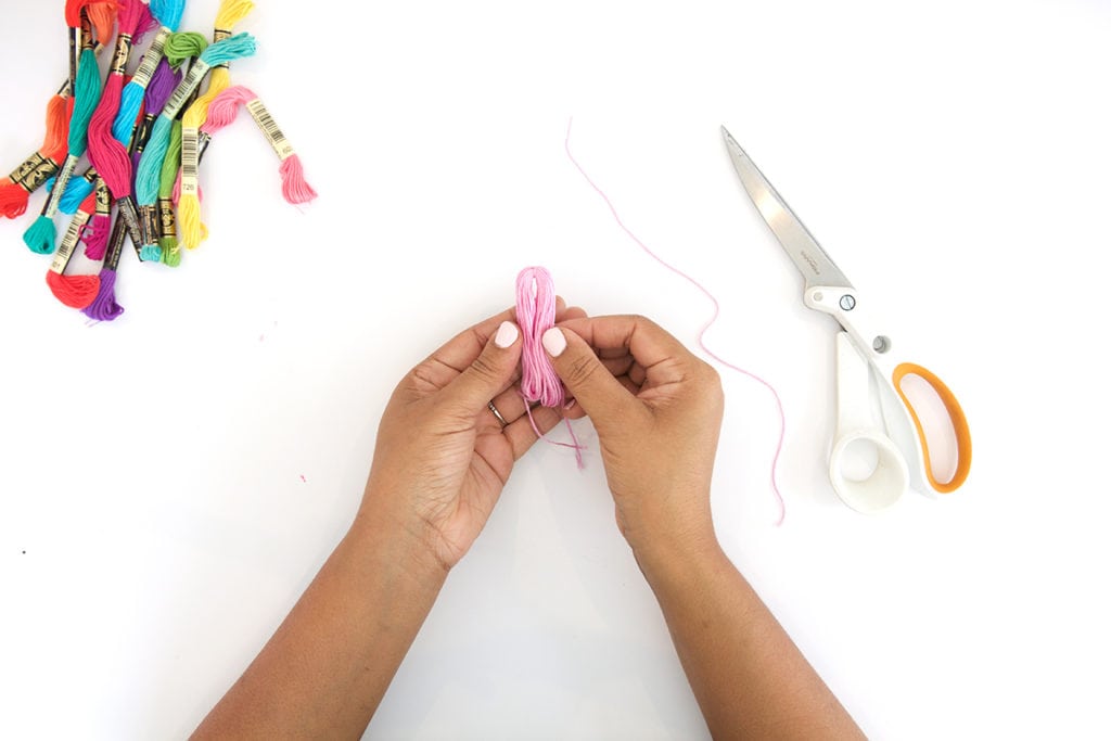 Use embroidery floss to create bold DIY tiered tassels for your beach tote.