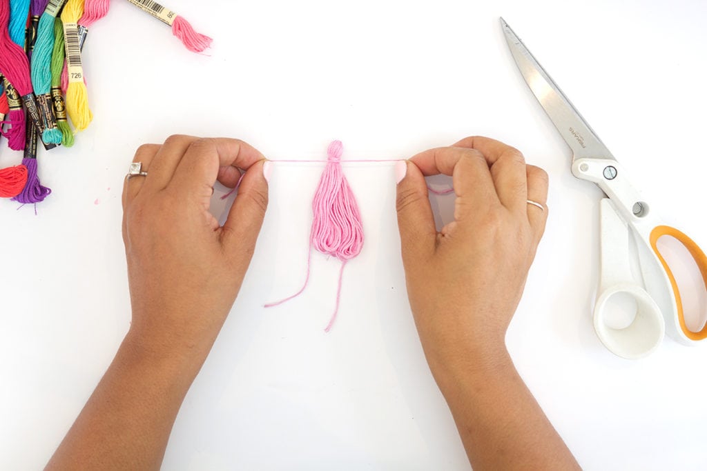 Use embroidery floss to create bold DIY tiered tassels for your beach tote.