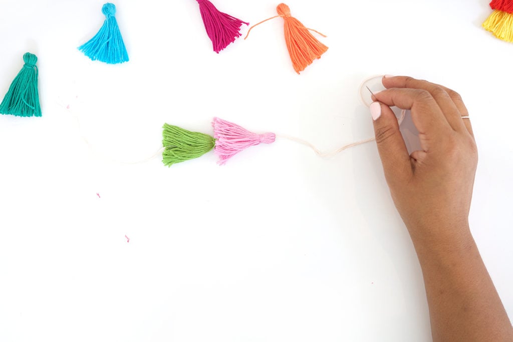 Use embroidery floss to create bold DIY tiered tassels for your beach tote.