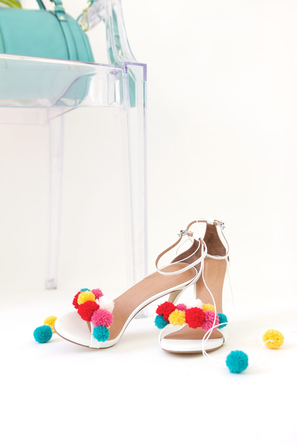 recreate this seasons hottest footwear by making your own DIY pom pom sandals. They will turn heads and save you a ton of money! 