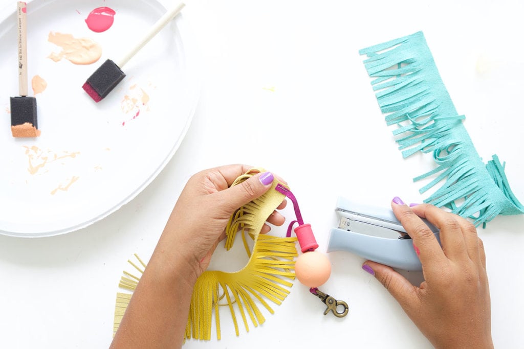 Tassels will never go out of style so why not create these leather and wood bead tassels in just a few steps.Your tote bag will thank you. 