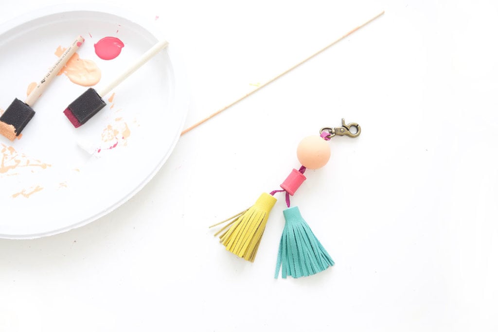 Tassels will never go out of style so why not create these leather and wood bead tassels in just a few steps.Your tote bag will thank you. 