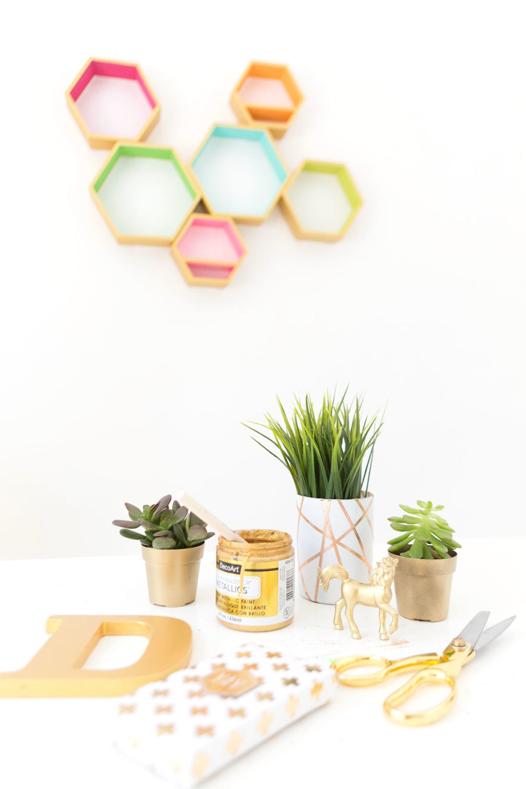 Create these DecoArt Metallic Hexagon Wall Shelves using DecoArt gold metallic paints to add perfect shimmer to your office walls.