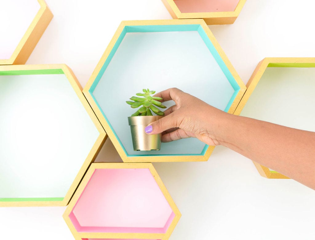 Create these DecoArt Metallic Hexagon Wall Shelves using DecoArt gold metallic paints to add perfect shimmer to your office walls.