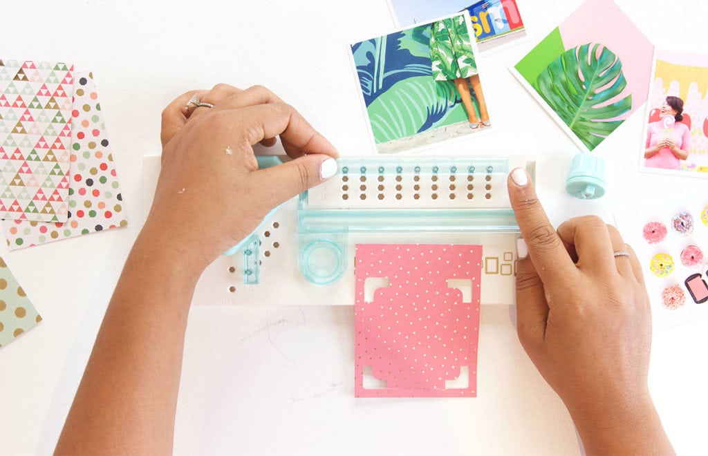 Use the We R Memory Keepers Frame Punch to create perfect paper polaroid frames for photos and other projects.