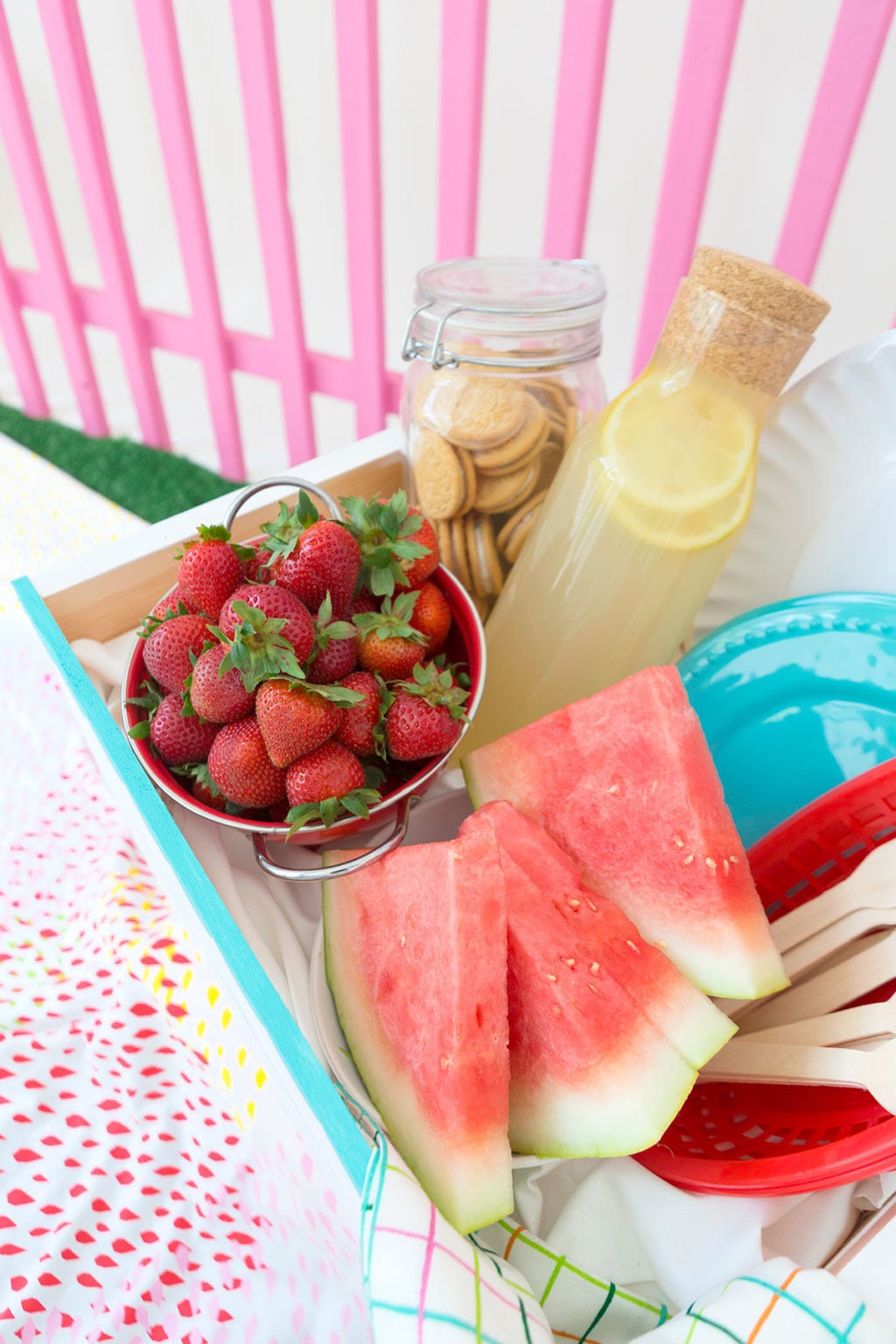 Enjoy the outdoors with this DIY Wooden Crate Picnic Basket that is easy to create with paint and simple tools. Great for enjoying the end of summer. 