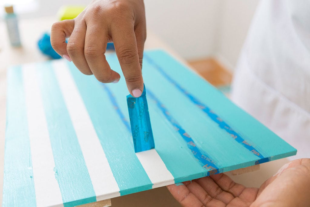 Enjoy the outdoors with this DIY Wooden Crate Picnic Basket that is easy to create with paint and simple tools. Great for enjoying the end of summer. 