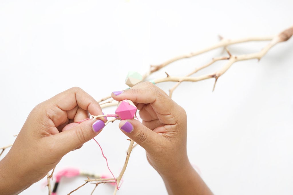 This painted wood bead manzanita branch is a funky take on the beauty of nature! A crafty way to use your painted wooden beads with a few basic supplies. 