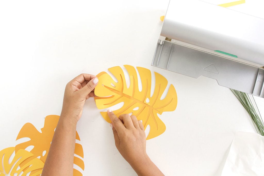 Autumn leaves are coming but I'm still holding on to summer. Combine both seasons with these DIY Paper Monstera Leaves made with a Cricut Explore