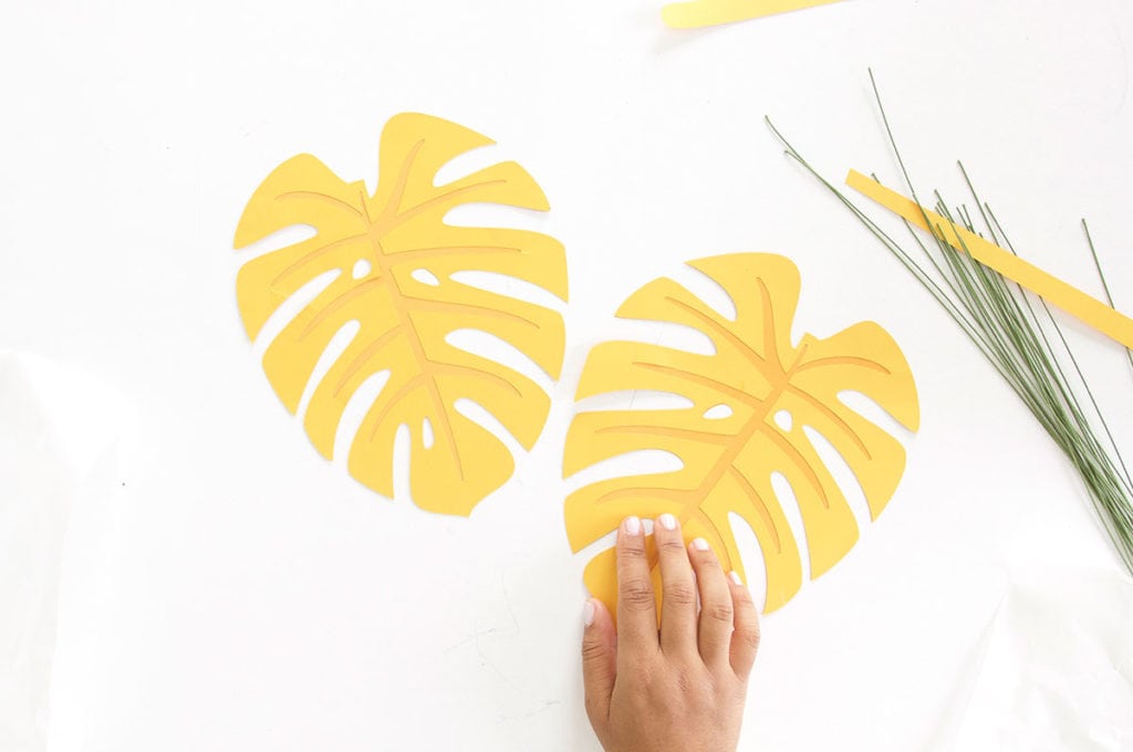 Autumn leaves are coming but I'm still holding on to summer. Combine both seasons with these DIY Paper Monstera Leaves made with a Cricut Explore