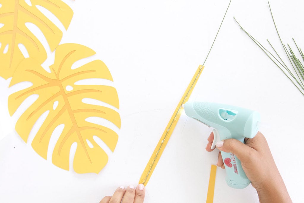 Autumn leaves are coming but I'm still holding on to summer. Combine both seasons with these DIY Paper Monstera Leaves made with a Cricut Explore