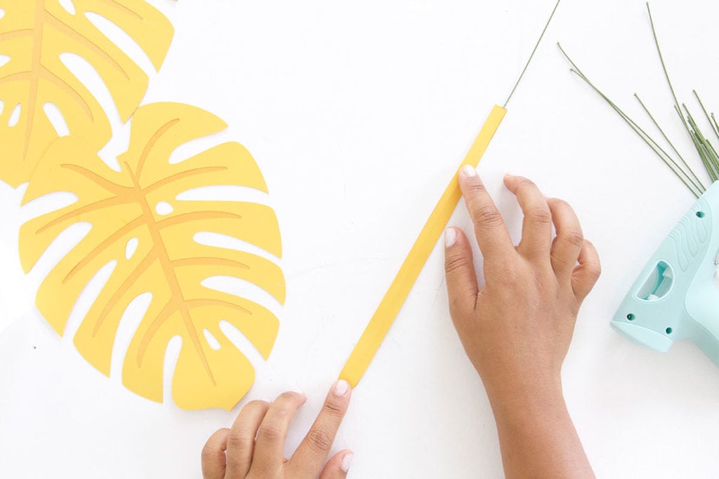 Autumn leaves are coming but I'm still holding on to summer. Combine both seasons with these DIY Paper Monstera Leaves made with a Cricut Explore