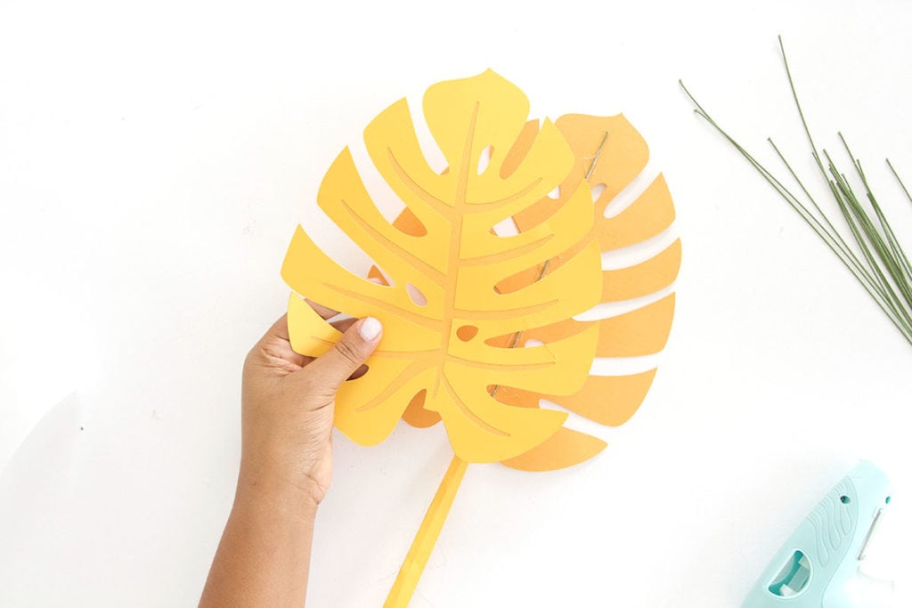 Autumn leaves are coming but I'm still holding on to summer. Combine both seasons with these DIY Paper Monstera Leaves made with a Cricut Explore