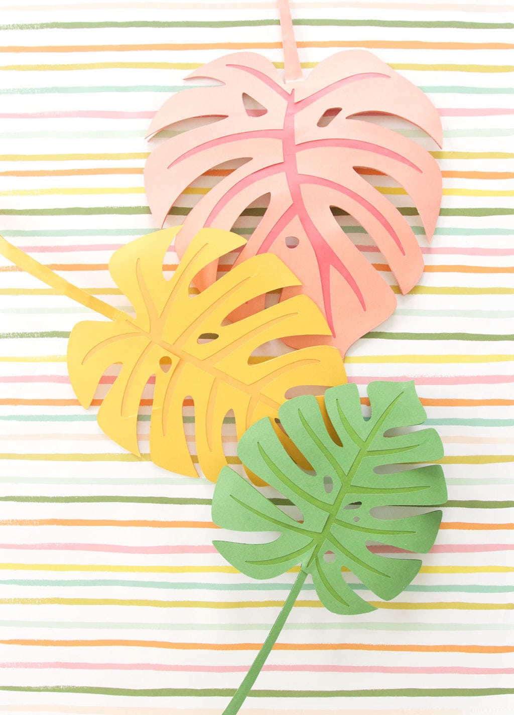 Autumn leaves are coming but I'm still holding on to summer. Combine both seasons with these DIY Paper Monstera Leaves made with a Cricut Explore