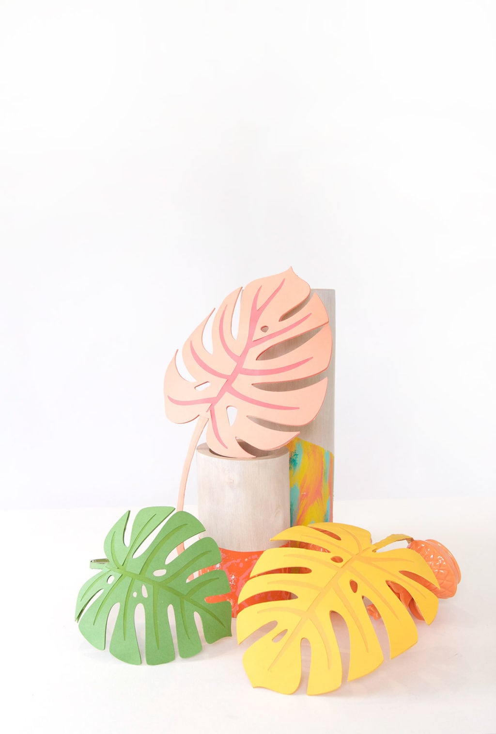 Autumn leaves are coming but I'm still holding on to summer. Combine both seasons with these DIY Paper Monstera Leaves made with a Cricut Explore