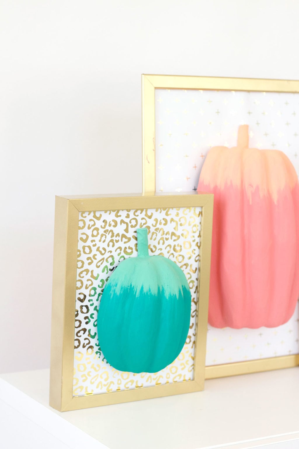 celebrate fall with bold colors and these easy DIY paper pumpkin wall art pieces. All you need is paint! 