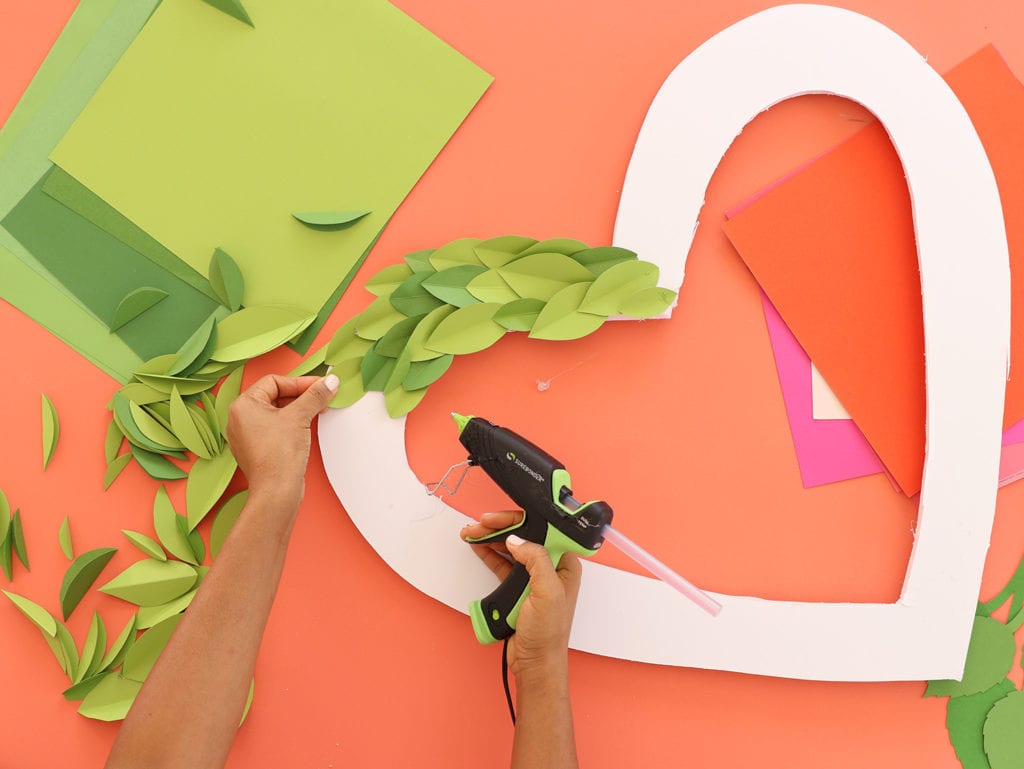 glue leaves and flowers onto foam board